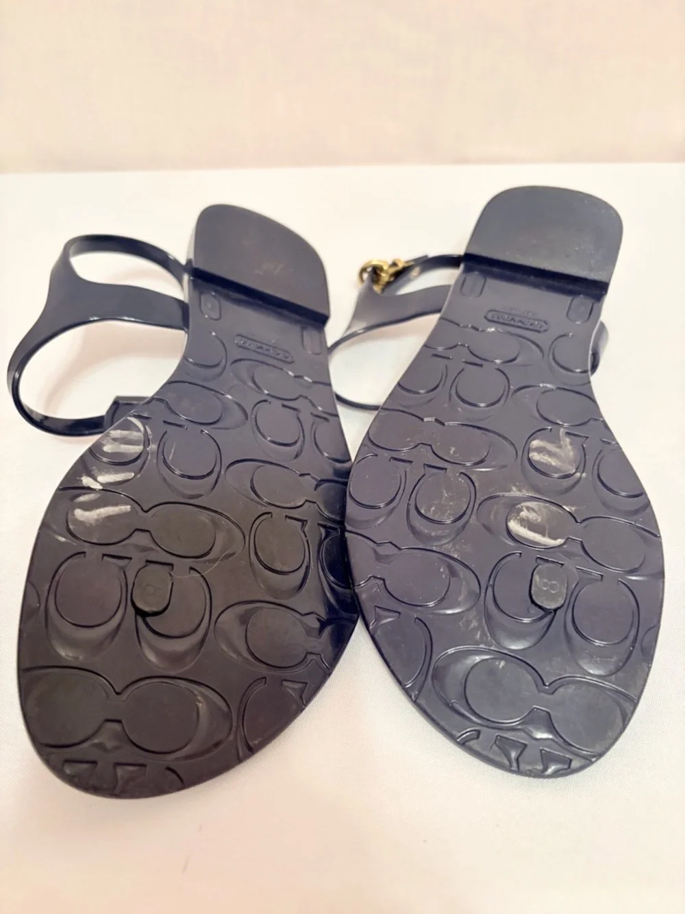 Coach Phila jelly thong sandals in navy blue/gold turnlock and O-ring details